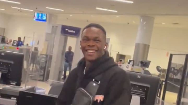 VIDEO: Israel Adesanya Hilariously Bumps Into UFC Nemesis at Airport