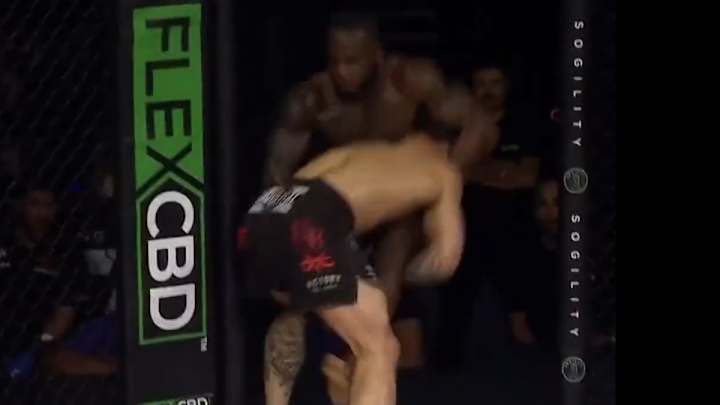 VIDEO: Takedown Sends MMA Fighters Flying Through Cage Door At LFA Event