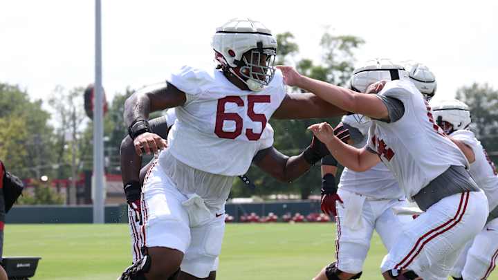 JC Latham Talks Weight Gain, Teaching Young Players on Offensive Line JC Latham Talks Weight Gain, Teaching Young Players on Offensive Line
