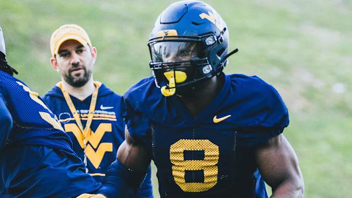 From Refugee Camps to Finding a Home Among the Hills: WVU LB Lee Kpogba's Journey From Refugee Camps to Finding a Home Among the Hills: WVU LB Lee Kpogba's Journey