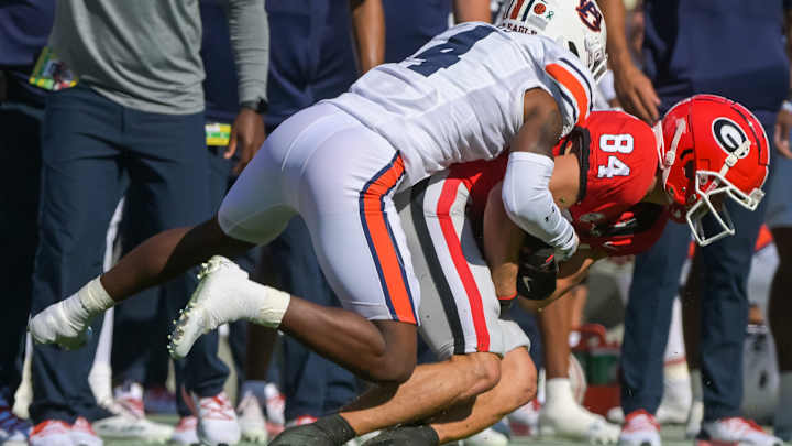Which position groups have over and under performed expectations for Auburn this season?