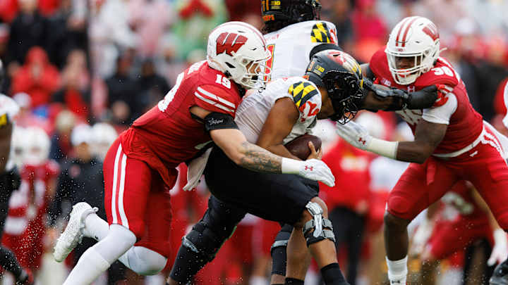 Wisconsin runs over Maryland 23-10 in the rain