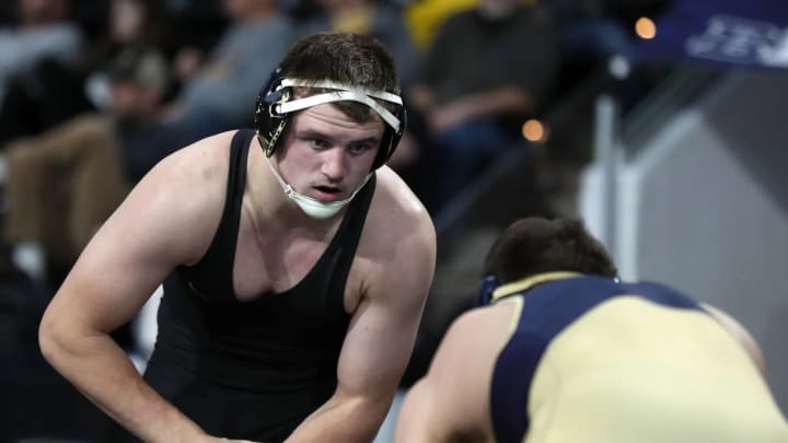 Michigan Takes Down Hawkeyes on Mat Michigan Takes Down Hawkeyes on Mat