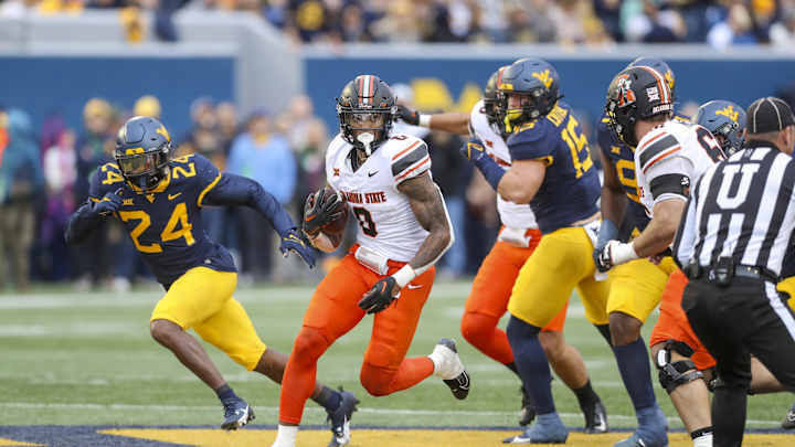 Oklahoma State Runs Over Mountaineers 48-34
