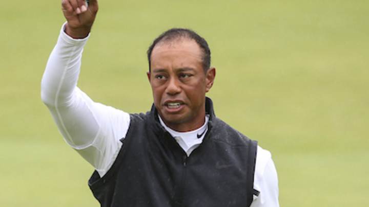 Woods exits Portrush, vows more time off
