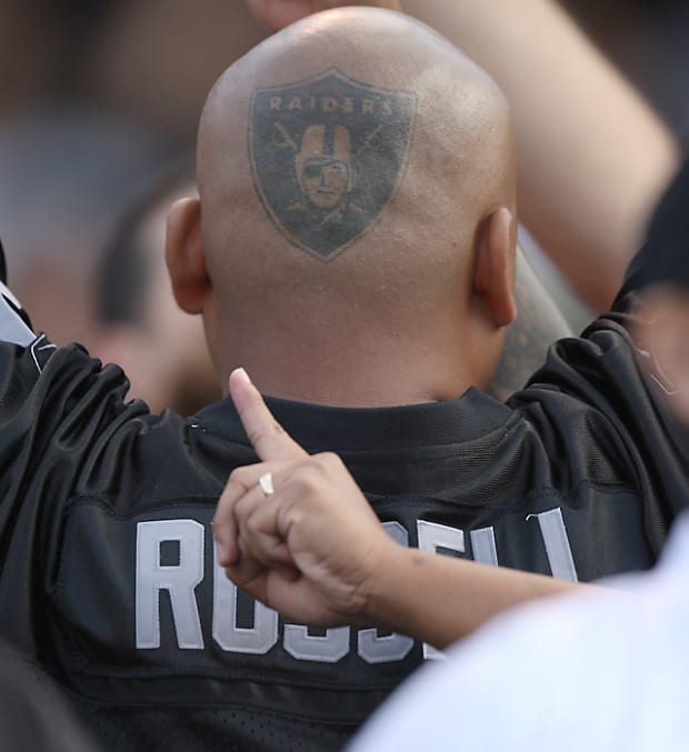Oakland Raiders fans Jon Gruden Chucky tattoo is something to behold