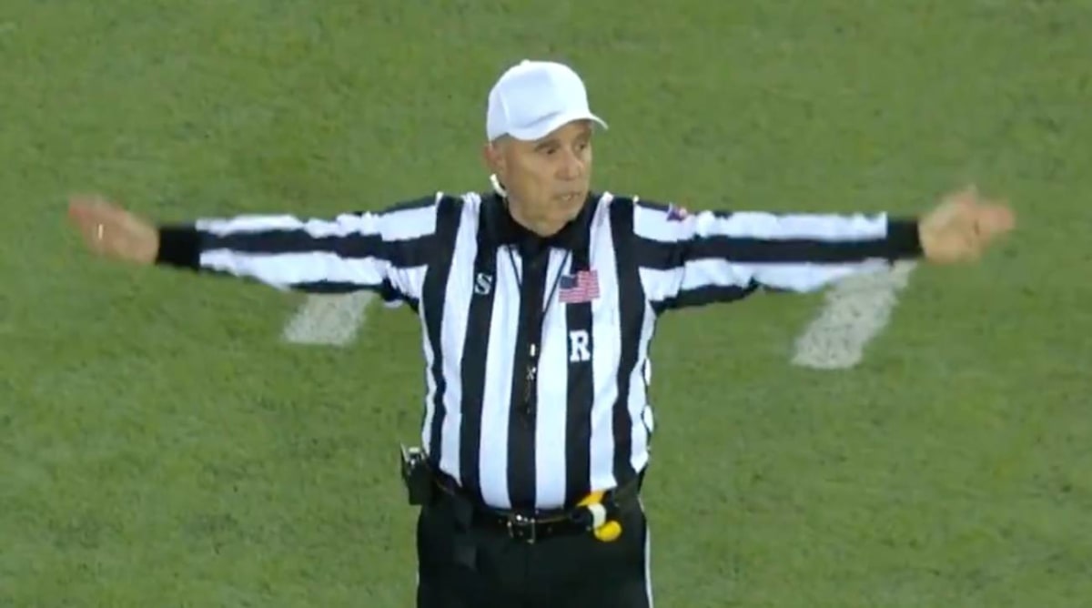 College Football Referee Accidentally Curses on Hot Mic in First