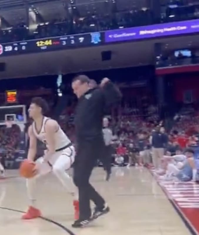 College Basketball Coach Wanders Waaaay Too Far Onto Court During Play