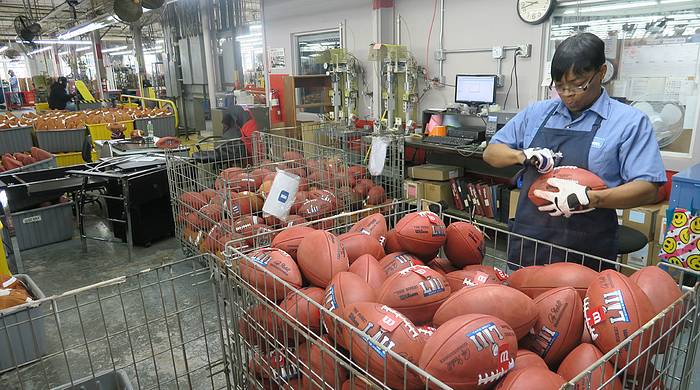 Super Bowl 52 balls getting inspected.