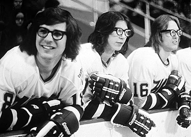 Collage-style image featuring the Hanson Brothers alongside modern hockey or sports-related themes