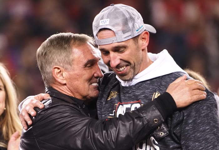 San Francisco 49ers head coach Kyle Shanahan celebrates the 37-20 victory against the Green Bay Packers with his father Mike Shanahan in the NFC Championship Game at Levi's Stadium.