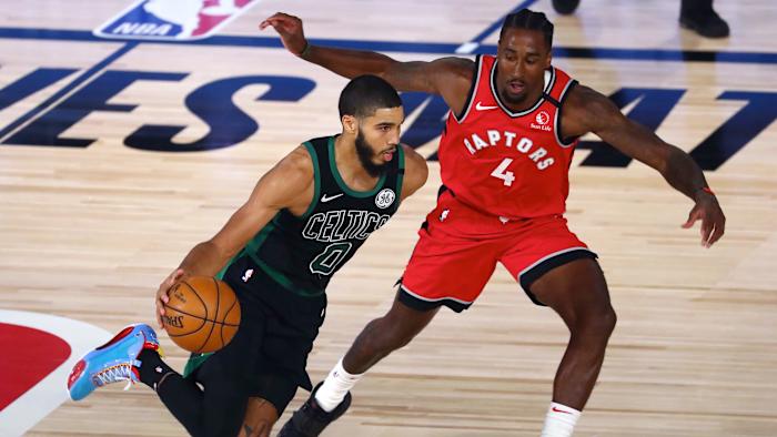 Boston Celtics forward Jayson Tatum (0) dribbles the ball against Toronto Raptors forward Rondae Hollis-Jefferson (4) during the second half of game five of the second round in the 2020 NBA Playoffs a...