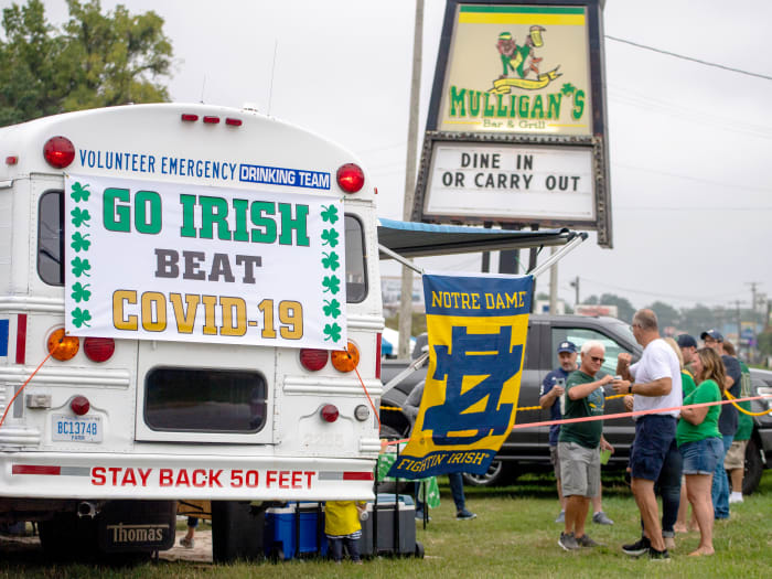 Sep 12, 2020; Notre Dame, Indiana, USA; Fans gather off-campus for the game between the Notre Dame Fighting Irish and the Duke Blue Devils at Notre Dame Stadium. Notre Dame limited seating capacity and banned tailgating on campus as part of its COVID-19 protocols.