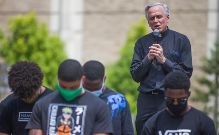 University of Notre Dame president Fr. John Jenkins leads a prayer during a celebration of Juneteenth by Notre Dame football players on Friday, June 19, 2020, at Notre Dame in South Bend, Ind.