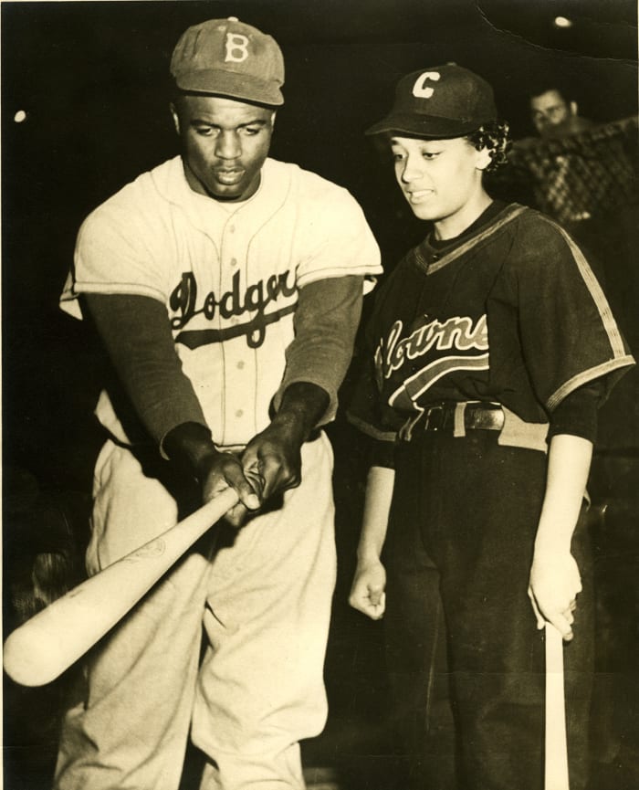 Morgan, with Jackie Robinson in 1954.
