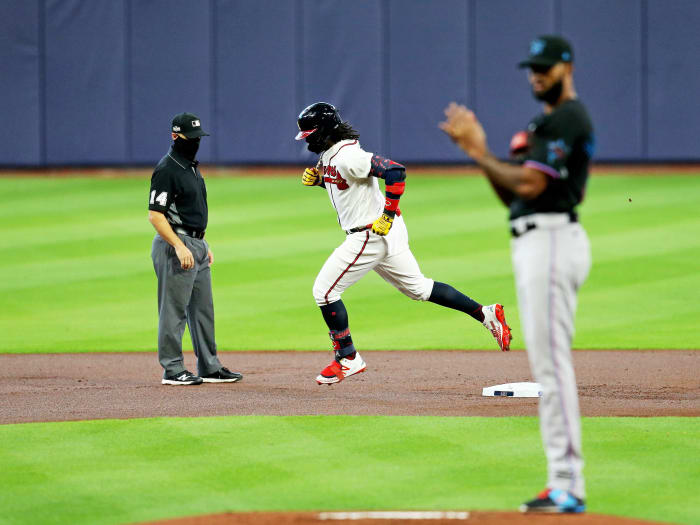Oct 6, 2020; Houston, Texas, USA; Atlanta Braves center fielder Ronald Acuna Jr. (13) rounds the bases after hitting a solo homerun in the 1st inning off of Miami Marlins starting pitcher Sandy Alcantara (22) during game one of the 2020 NLDS at Minute Maid Park.