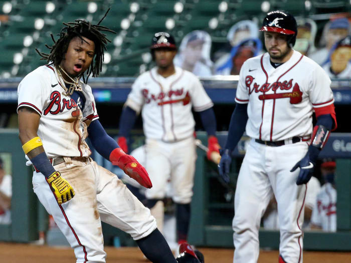 Oct 6, 2020; Houston, Texas, USA; Atlanta Braves center fielder Ronald Acuna Jr. (13) celebrates after scoring a run in the 3rd inning against the Miami Marlins during game one of the 2020 NLDS at Minute Maid Park.