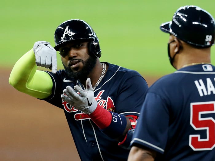 Oct 8, 2020; Houston, Texas, USA; Atlanta Braves designated hitter Marcell Ozuna (20) reacts after hitting a single against the Miami Marlins during the sixth inning of game three of the 2020 NLDS at Minute Maid Park.
