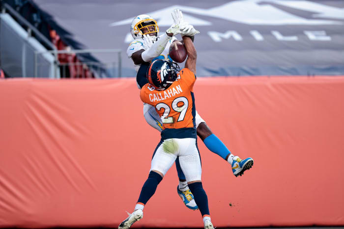 Denver Broncos cornerback Bryce Callahan (29) battles for the ball with Los Angeles Chargers wide receiver Mike Williams (81) in the third quarter at Empower Field in Mile High.