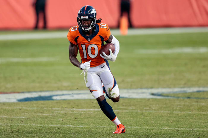 Denver Broncos wide receiver Jerry Judy, 10, runs the ball in a fourth-quarter reception against the Denver Broncos at Empower Field at Mile High.