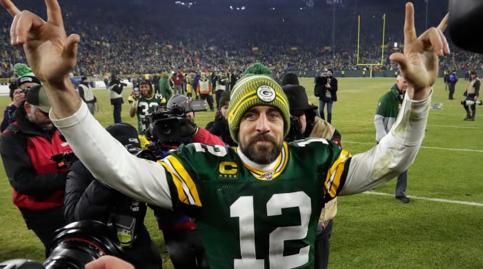 Aaron Rodgers celebrates the Packers' 28-23 win over the Seattle Seahawks in January 2020 to advance to the conference championship.