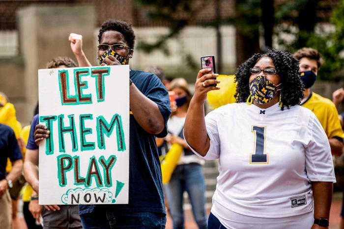 Big Ten fans hold up 'Let Them Play' signs