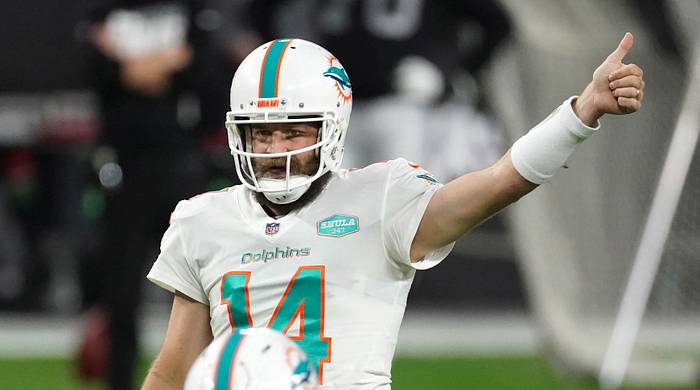 Miami Dolphins quarterback Ryan Fitzpatrick plays in the fourth quarter against the Las Vegas Raiders at Allegiant Stadium.