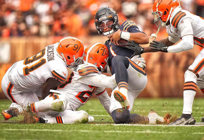 Justin Fields slides down during a game against the Browns