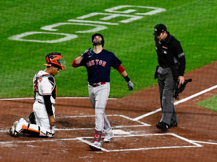 Sep 29, 2021; Baltimore, Maryland, USA;  Boston Red Sox left fielder J.D. Martinez (28) celebrates hitting a second inning solo home run as Baltimore Orioles catcher Pedro Severino (28) looks on at Oriole Park at Camden Yards.