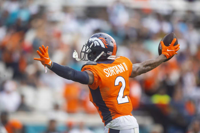 Denver Broncos cornerback Putt Thirteen II (2) celebrates an interception against the Jacksonville Jaguars at TIAA Bank Field.