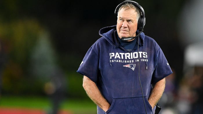 Bill Belichick looks at the scoreboard during a loss to Tom Brady and the Bucs