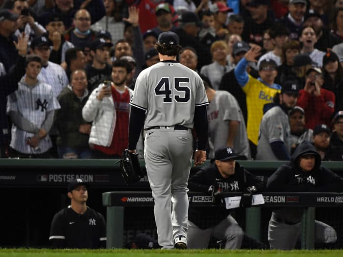 New York Yankees starting pitcher Gerrit Cole (45) walks to the dugout after being pulled against the Boston Red Sox during the third inning of the American League Wildcard game at Fenway Park.