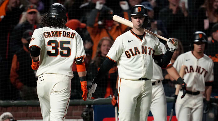 October 8, 2021;  San Francisco, California, United States;  San Francisco Giants shortstop Brandon Crawford (35) celebrates with receiver Buster Posey (28) after hitting a home run in the eighth inning against the Los Angeles Dodgers during the first game of the 2021 NLDS at Oracle Park .