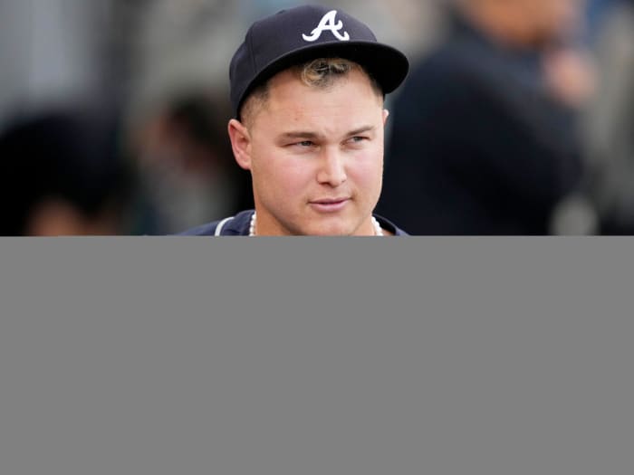 October 21, 2021;  Los Angeles, California, United States;  Atlanta Braves right fielder Joc Pederson (22) wears pearls on the bench before Game 5 of the 2021 National League Championship Series against the Los Angeles Dodgers at Dodger Stadium.