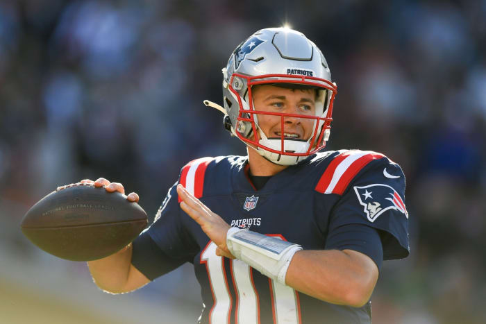 October 24, 2021;  Foxborough, Massachusetts, United States;  New England Patriots quarterback Mac Jones (10) throws a ball on the sidelines during a game against the New York Jets at Gillette Stadium.
