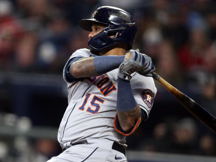 Houston Astros wide receiver Martin Maldonado (15) hits an RBI double against the Atlanta Braves during the seventh inning of Game 5 of the 2021 World Series at Truist Park.
