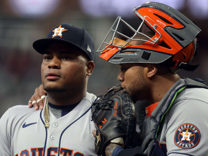 Houston Astros wide receiver Martin Maldonado (15) talks to starting pitcher Framber Valdez (59) after he gave up a grand slam during the game against the Atlanta Braves in the first inning of Game 5.
