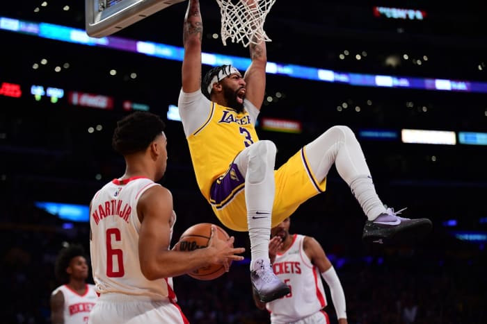 November 2, 2021;  Los Angeles, California, USA;  Los Angeles Lakers striker Anthony Davis (3) thumps after a basket in front of Houston Rockets striker Kenyon Martin Jr.  (6) in the second half at the Staples Center.  Mandatory Credit: Gary A. Vasquez-USA TODAY Sports