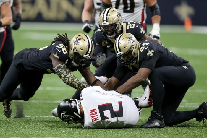 November 7, 2021;  New Orleans, Louisiana, United States;  Atlanta Falcons quarterback Matt Ryan (2) is sacked by linebacker Demario Davis (56) and safety Malcolm Jenkins (27) and defensive end Cameron Jordan (94) during the second half at the Caesars Superdome.  Mandatory Credit: Chuck Cook-USA TODAY Sports