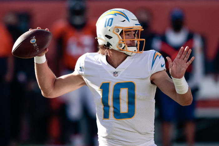 Los Angeles Chargers quarterback Justin Herbert (10) looks to pass in the first quarter against the Denver Broncos at Empower Field at Mile High.