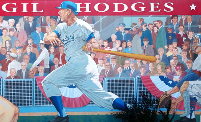 A 52' x 16' mural of Gil Hodges, painted by Randy Hedden, stands at the corner of Hwy 61 and Hwy 57 in Petersburg, Ind., Hodges' hometown. Hodges is portrayed as a player for the Brooklyn Dodgers (part of two World Series winning Dodgers teams – 1955 in Brooklyn and 1959 in Los Angeles) and manager for the New York Mets (captained the Miracle Mets to their first-ever World Series title in 1969).