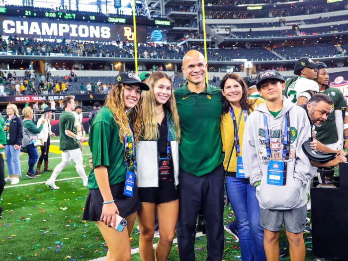 Dave Aranda poses with his family on the field after the Big 12 championship