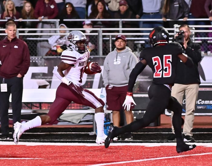 Oct 2, 2021;  Cheney, WA, USA;  Montana Grizzlies running back Xavier Harris (13) is chased by Eastern Washington Eagles defenseman Ely Doyle (25) in the second half at Roos Field.  Eagles won 34-28.  Mandatory Credit: James Snook-USA TODAY Sports