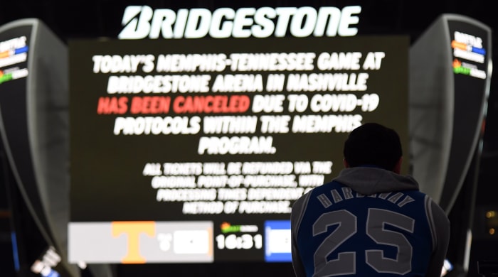 A Memphis Tigers fan looks on as Tennessee Volunteers players scrimmage after the game was canceled due to COVID protocol in the Tiger program at Bridgestone Arena.