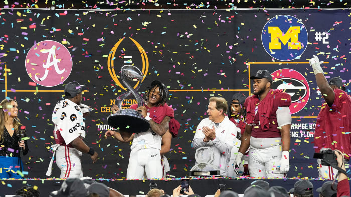 Alabama holds the trophy after the Cotton Bowl semifinal against Cincinnati
