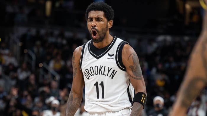 Brooklyn Nets guard Kyrie Irving (11) reacts to a basket made in the second half against the Indiana Pacers.