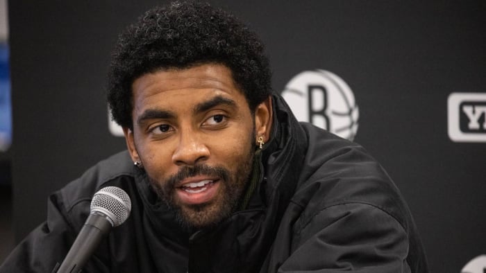 Brooklyn Nets guard Kyrie Irving (11) talks to the media after the game against the Indiana Pacers.