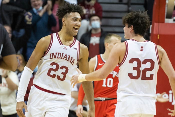 Trayce Jackson-Davis and Trey Galloway celebrate after a play.