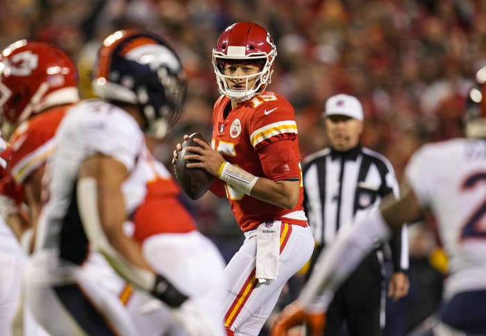 Kansas City Chiefs quarterback Patrick Mahomes (15) drops back to pass against the Denver Broncos during the first half at GEHA Field at Arrowhead Stadium.