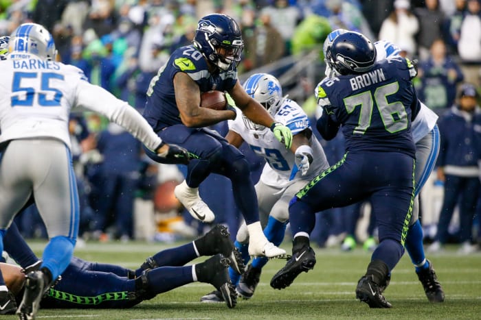 NFL: Detroit Lions vs. Seattle Seahawks on January 2, 2022;  Seattle, Washington, USA;  Seattle Seahawks running back Rashaad Penny (20) rushes against the Detroit Lions during the fourth quarter at Lumen Field.
